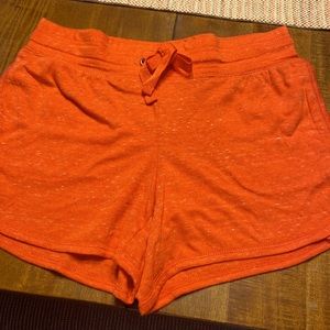 Orange cotton sleep or athletic shorts.